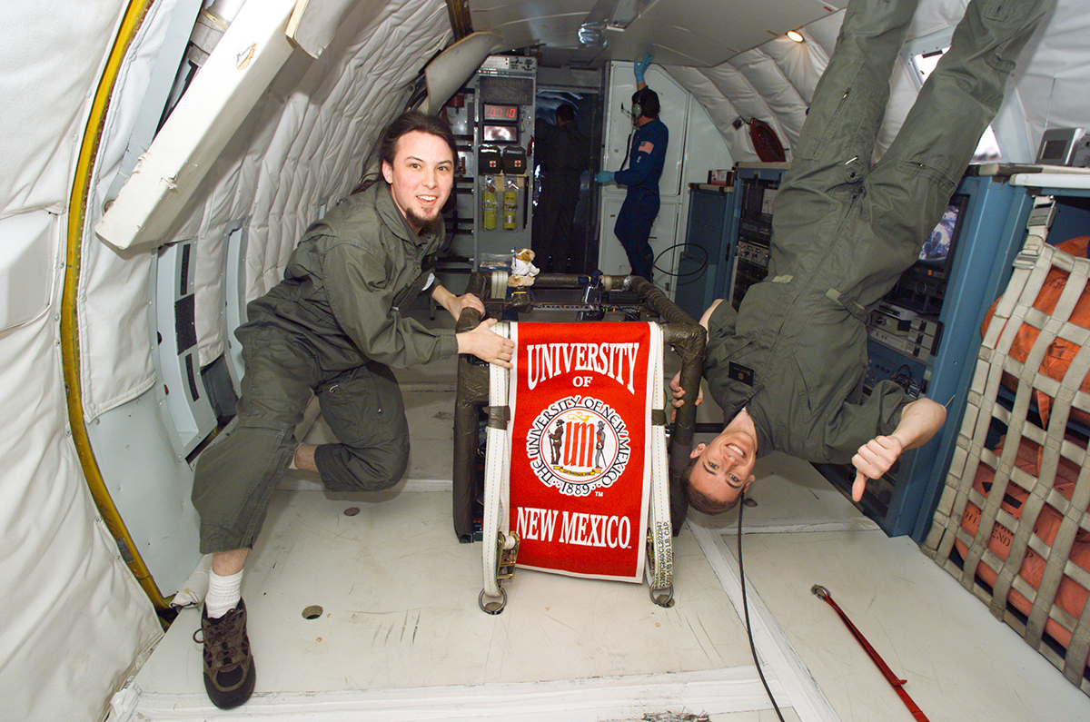 photo: Daniel Casey (left) as a student at UNM with follow nuclear engineering student Thomas Quirk at the microgravity university KC-135 simulation.